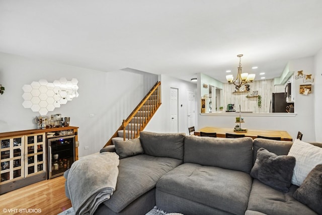1039 Talbots Ln, Elk Grove Village, IL 60007 - living area with wine cooler, a chandelier, stairway, light wood finished floors, and a bar