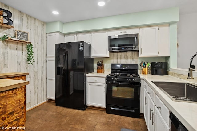 1039 Talbots Ln, Elk Grove Village, IL 60007 - kitchen featuring black appliances, light countertops, white cabinetry, open shelves, and wood walls