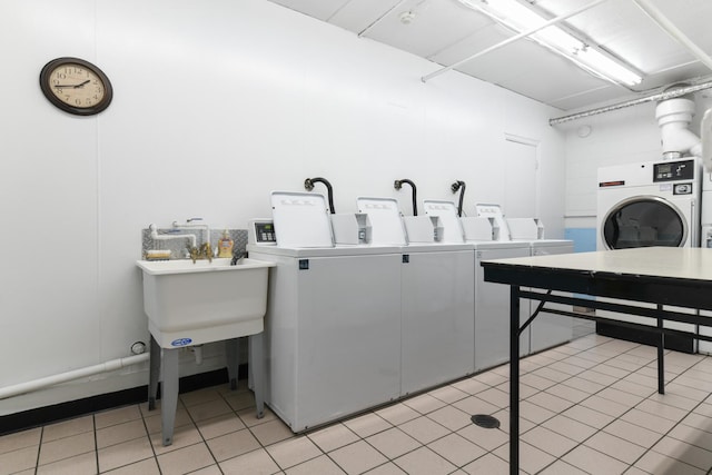 5400 Carriageway Dr Unit 315, Rolling Meadows, IL 60008 - shared laundry room featuring washer and clothes dryer and light tile patterned flooring