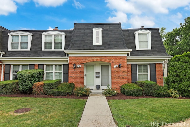 336 Eastern Ave, Barrington, IL 60010 - view of front of home with mansard roof, brick siding, roof with shingles, and a front yard