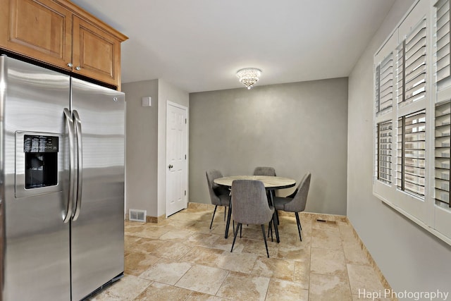 336 Eastern Ave, Barrington, IL 60010 - dining area featuring stone tile flooring and baseboards