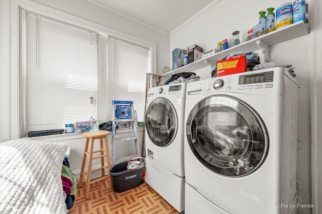 6121 N Hoyne Ave Unit 1S, Chicago, IL 60659 - laundry area featuring ornamental molding and washer and clothes dryer