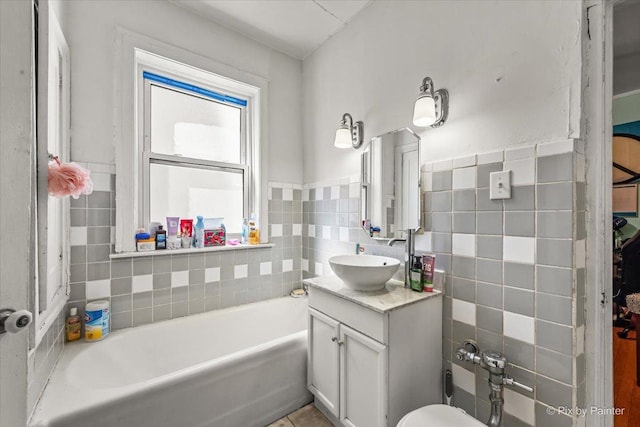 6121 N Hoyne Ave Unit 1S, Chicago, IL 60659 - full bathroom featuring tile walls, a bath, and vanity