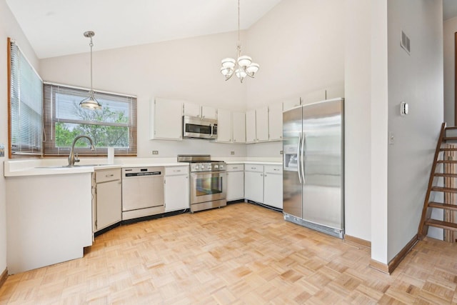397 Briarwood Ct, Gurnee, IL 60031 - kitchen with stainless steel appliances, a chandelier, high vaulted ceiling, light countertops, and decorative light fixtures