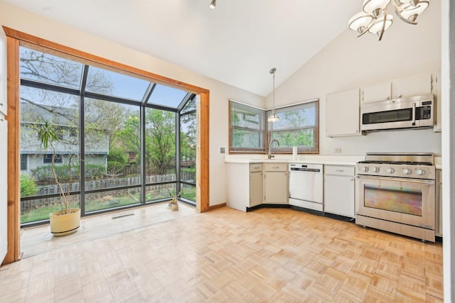 397 Briarwood Ct, Gurnee, IL 60031 - kitchen with stainless steel appliances, light countertops, a chandelier, healthy amount of natural light, and high vaulted ceiling