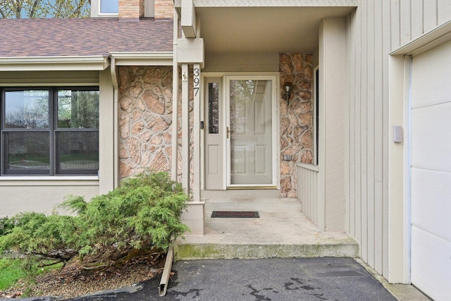 397 Briarwood Ct, Gurnee, IL 60031 - view of exterior entry with stone siding and roof with shingles