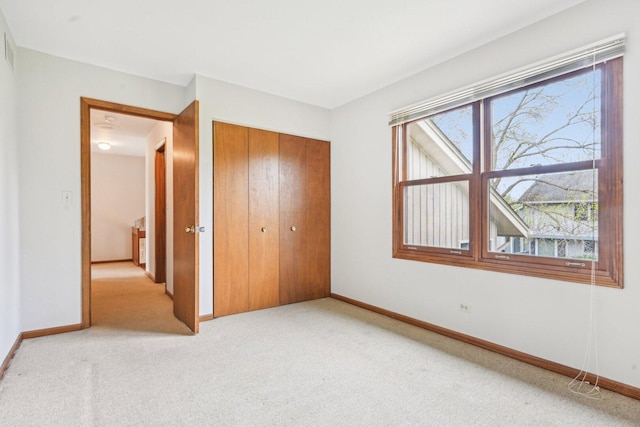 397 Briarwood Ct, Gurnee, IL 60031 - unfurnished bedroom featuring light carpet and a closet
