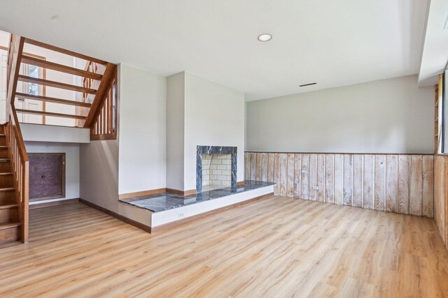 397 Briarwood Ct, Gurnee, IL 60031 - unfurnished living room featuring stairs, wood finished floors, and a multi sided fireplace