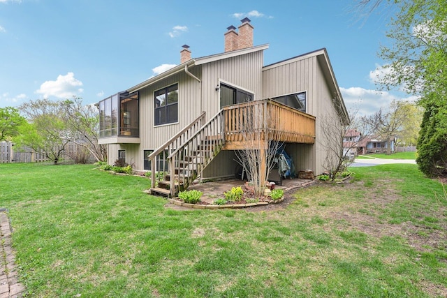397 Briarwood Ct, Gurnee, IL 60031 - rear view of property featuring a chimney, a yard, stairs, and a wooden deck