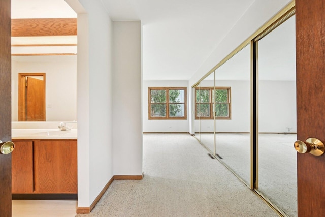 397 Briarwood Ct, Gurnee, IL 60031 - hallway featuring a sink and baseboards