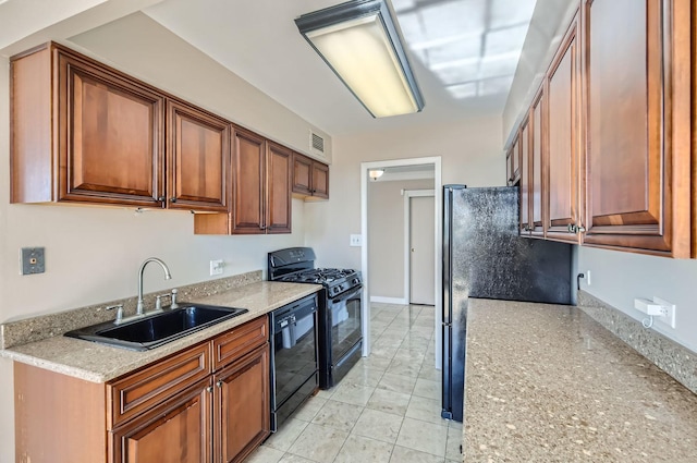 20 N Tower Rd Unit 12M, Oak Brook, IL 60523 - kitchen featuring black appliances and brown cabinetry