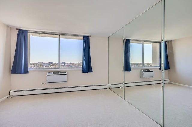 20 N Tower Rd Unit 12M, Oak Brook, IL 60523 - carpeted empty room with plenty of natural light, an AC wall unit, and a wall unit AC
