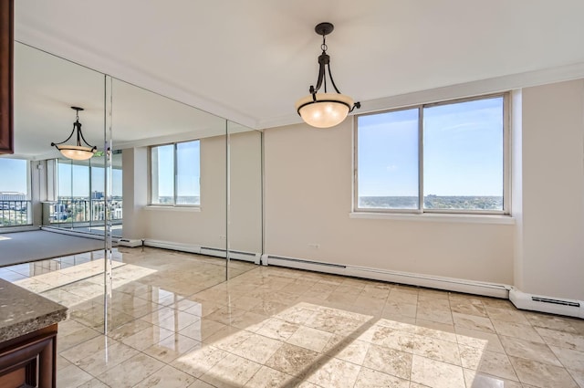 20 N Tower Rd Unit 12M, Oak Brook, IL 60523 - spare room with baseboards and a baseboard radiator
