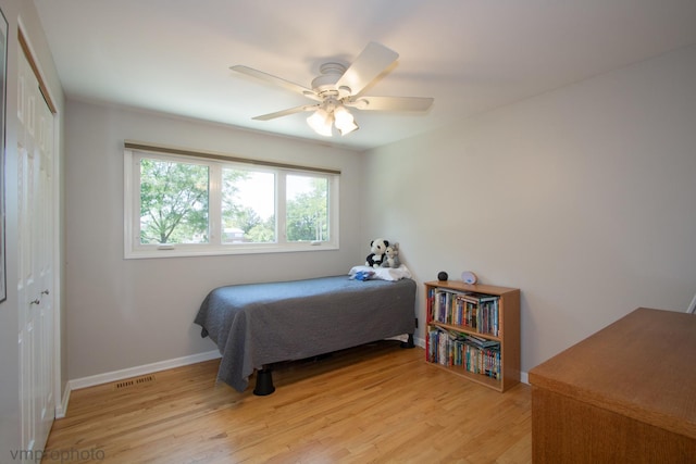 407 Danbury Ct, Schaumburg, IL 60193 - bedroom with a closet, light wood-type flooring, and a ceiling fan
