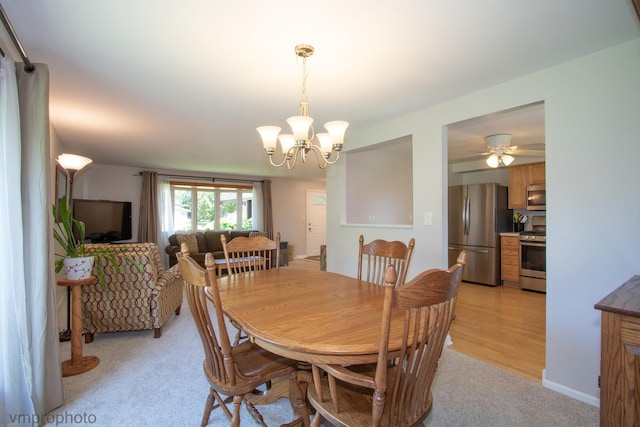 407 Danbury Ct, Schaumburg, IL 60193 - dining space featuring light colored carpet, a chandelier, and ceiling fan