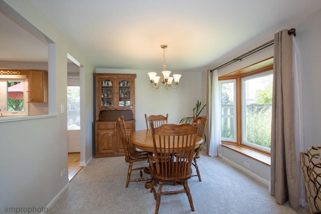 407 Danbury Ct, Schaumburg, IL 60193 - dining space featuring a chandelier and light carpet