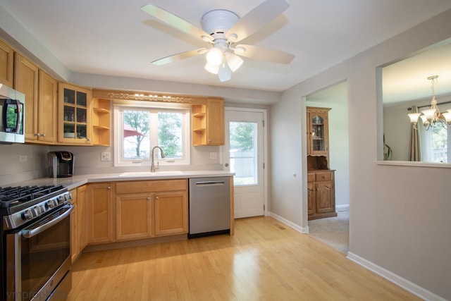 407 Danbury Ct, Schaumburg, IL 60193 - kitchen featuring appliances with stainless steel finishes, open shelves, a chandelier, light wood-type flooring, and glass insert cabinets