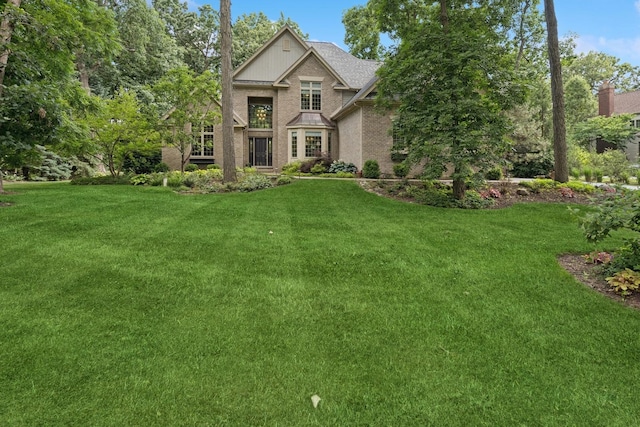 5803 Tomlinson Dr, Mchenry, IL 60050 - view of front of house featuring a front lawn and brick siding