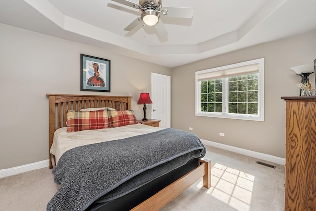 5803 Tomlinson Dr, Mchenry, IL 60050 - bedroom featuring a tray ceiling, carpet flooring, and ceiling fan