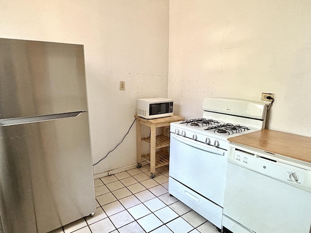 6103 S Ingleside Ave Unit 1, Chicago, IL 60637 - kitchen featuring white appliances, light tile patterned flooring, and light countertops