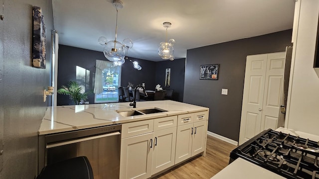 16 Forest Ln, Cary, IL 60013 - kitchen with dishwasher, white cabinetry, light wood-type flooring, light stone countertops, and gas stove