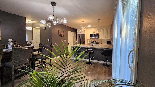 16 Forest Ln, Cary, IL 60013 - dining room with wood finished floors and a chandelier
