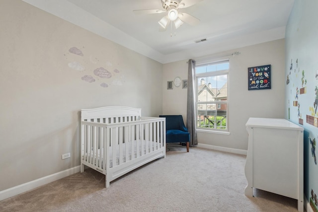 8471 Callie Ave, Morton Grove, IL 60053 - bedroom with light carpet, ceiling fan, and a nursery area