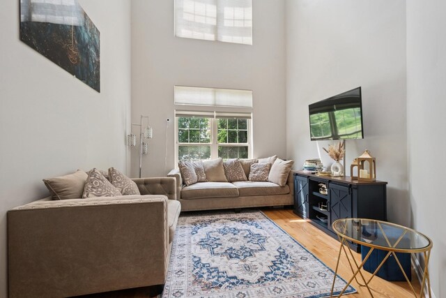 8471 Callie Ave, Morton Grove, IL 60053 - living area with a towering ceiling and light wood-type flooring