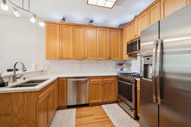 8471 Callie Ave, Morton Grove, IL 60053 - kitchen featuring appliances with stainless steel finishes, light wood-style floors, tasteful backsplash, and light countertops