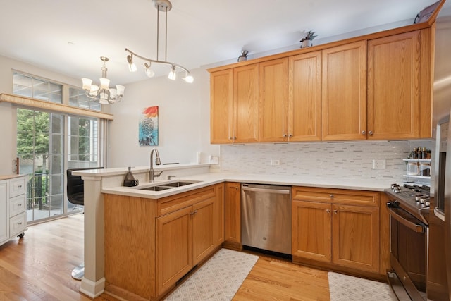 8471 Callie Ave, Morton Grove, IL 60053 - kitchen with appliances with stainless steel finishes, light wood-style floors, a peninsula, and backsplash