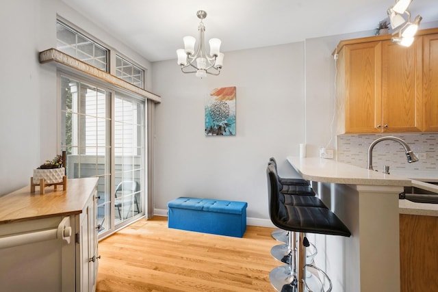 8471 Callie Ave, Morton Grove, IL 60053 - dining space with light wood-type flooring and a chandelier