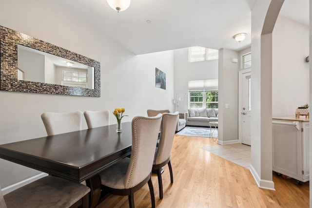 8471 Callie Ave, Morton Grove, IL 60053 - dining area featuring light wood-style flooring and arched walkways
