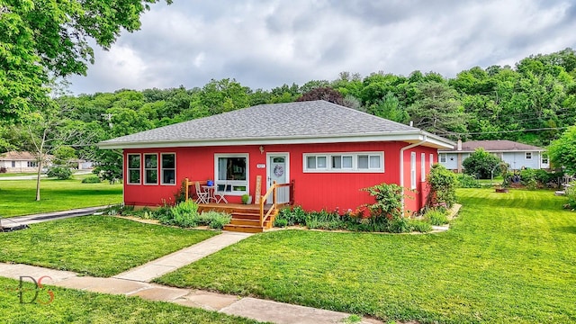 927 Clark St, Marseilles, IL 61341 - bungalow featuring a front lawn and a view of trees