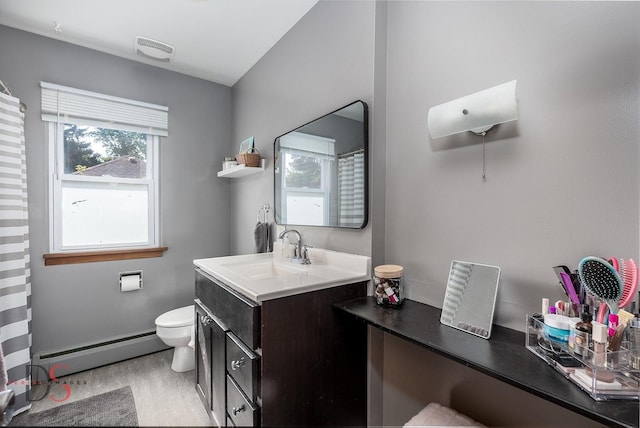 927 Clark St, Marseilles, IL 61341 - bathroom featuring baseboard heating, vanity, a shower with shower curtain, and wood finished floors