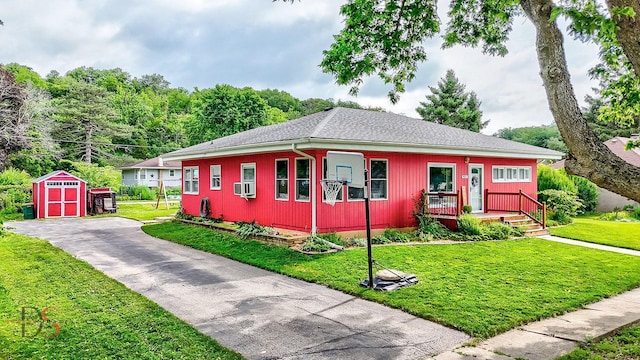 927 Clark St, Marseilles, IL 61341 - view of front of home with a storage unit, a front lawn, and cooling unit
