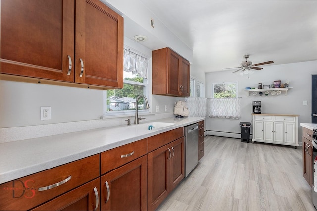927 Clark St, Marseilles, IL 61341 - kitchen featuring dishwasher, light countertops, light wood-style floors, a ceiling fan, and baseboard heating