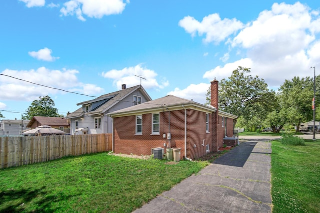 2621 Ridge Rd, Lansing, IL 60438 - view of side of home with brick siding and a chimney