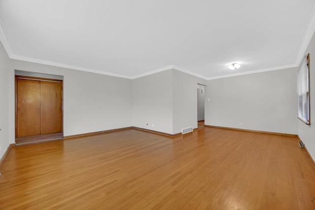2621 Ridge Rd, Lansing, IL 60438 - empty room with light wood finished floors and crown molding