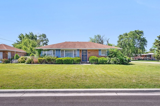 7859 78th St, Bridgeview, IL 60455 - ranch-style house with a front lawn and brick siding