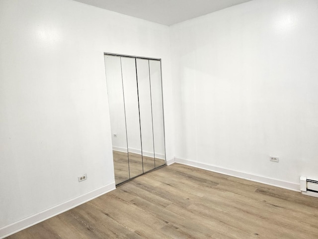 543 E 60th St Unit 1, Chicago, IL 60637 - unfurnished bedroom featuring wood finished floors and a closet