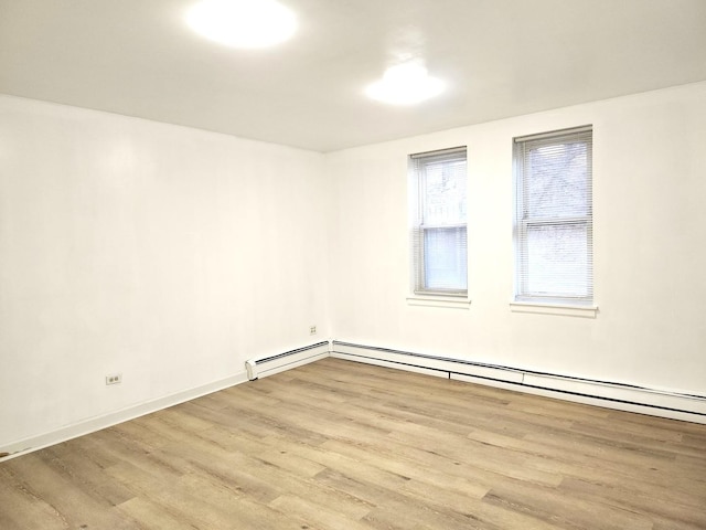543 E 60th St Unit 1, Chicago, IL 60637 - empty room with wood finished floors and baseboards