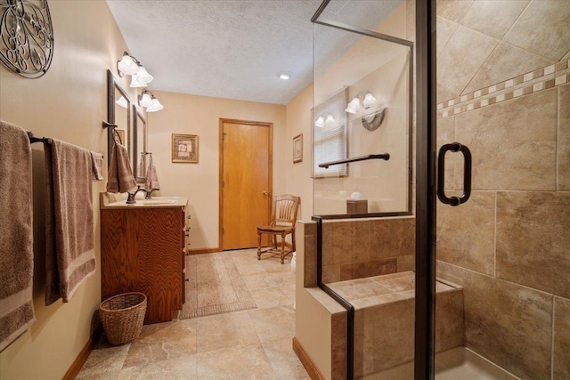 2210 Hedgewood Dr, Bloomington, IL 61704 - bathroom featuring vanity, a stall shower, and a textured ceiling
