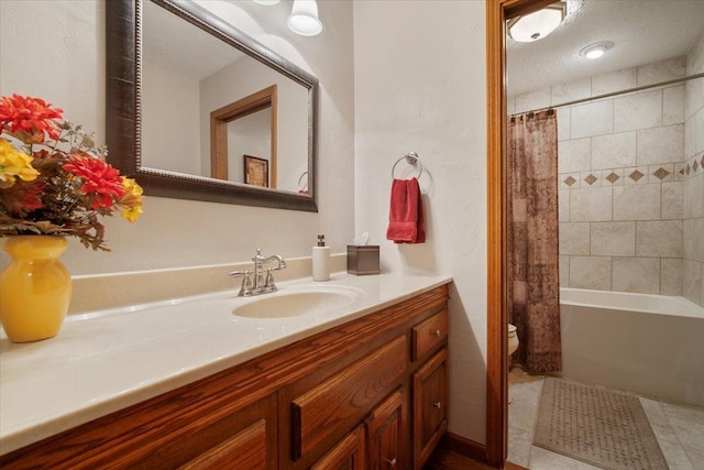 2210 Hedgewood Dr, Bloomington, IL 61704 - bathroom featuring vanity, shower / bathtub combination with curtain, and a textured ceiling