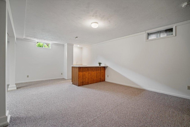 2210 Hedgewood Dr, Bloomington, IL 61704 - basement featuring bar area, carpet, and a textured ceiling