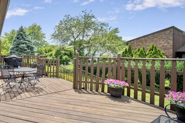 2210 Hedgewood Dr, Bloomington, IL 61704 - wooden deck with outdoor dining area and area for grilling