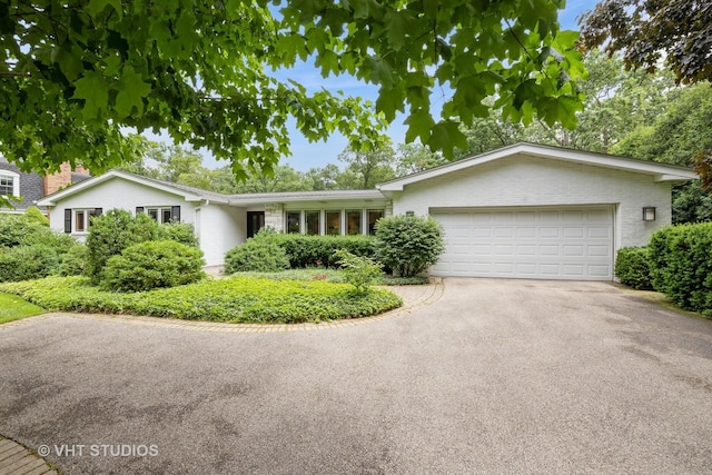 855 Beverly Pl, Lake Forest, IL 60045 - single story home featuring asphalt driveway, an attached garage, and brick siding