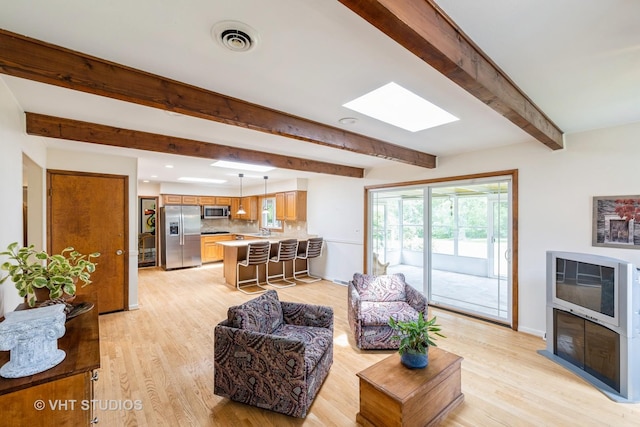 855 Beverly Pl, Lake Forest, IL 60045 - living room with a skylight, light wood finished floors, beam ceiling, and recessed lighting