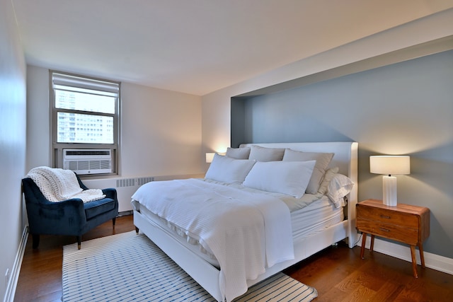 3950 N Lake Shore Dr Unit 810B, Chicago, IL 60613 - bedroom featuring radiator heating unit, wood finished floors, and cooling unit