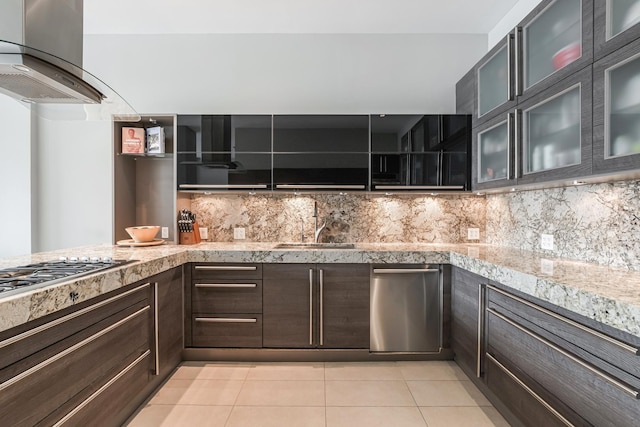 33 W Ontario St Unit Th5, Chicago, IL 60654 - kitchen with wall chimney exhaust hood, light tile patterned floors, appliances with stainless steel finishes, backsplash, and glass insert cabinets
