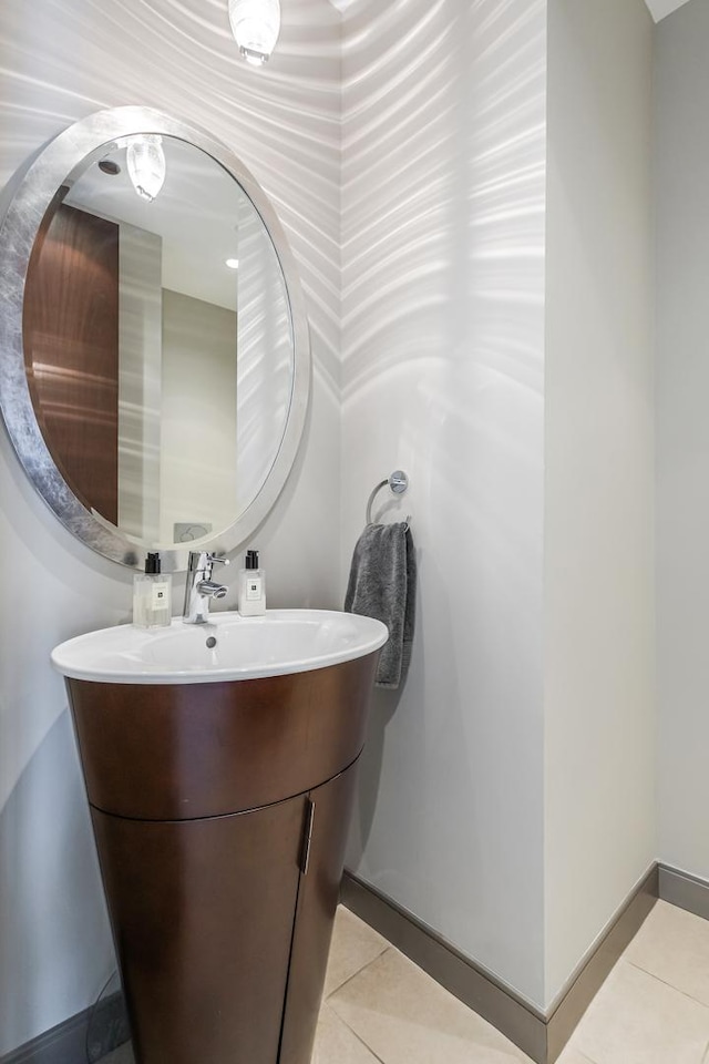 33 W Ontario St Unit Th5, Chicago, IL 60654 - half bathroom with vanity and tile patterned flooring